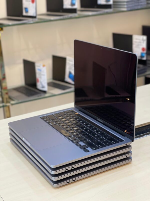 Left side view of Apple MacBook Pro 2022 with smooth edge and minimalist design
