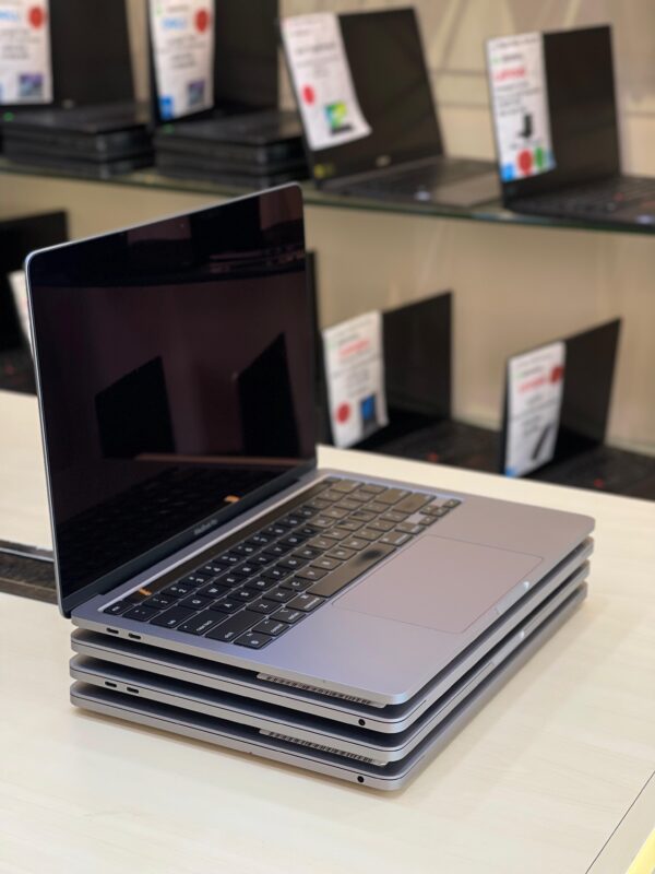Right side view of Apple MacBook Pro 2022 showing ports and ultra-slim design