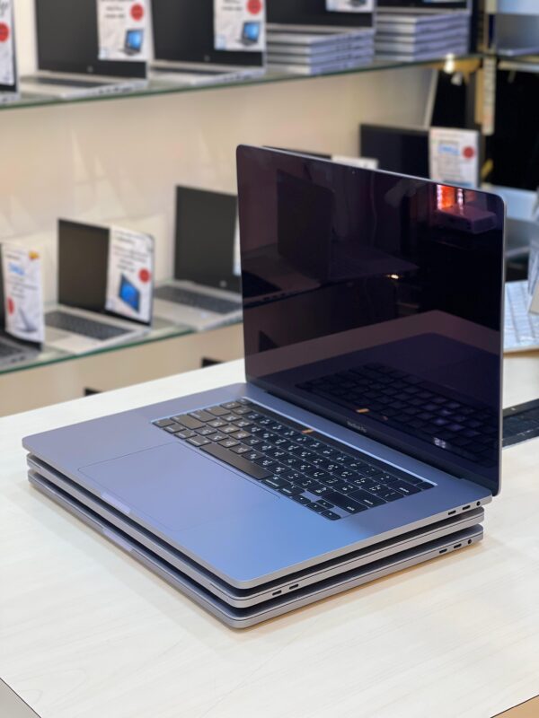 Left side view of Apple MacBook Pro 2019 showcasing slim design and connectivity ports