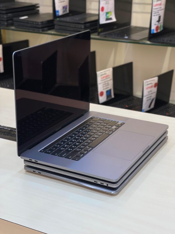 Right side view of Apple MacBook Pro 2019 showing slim aluminum design and ports